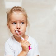 child with tooth brush